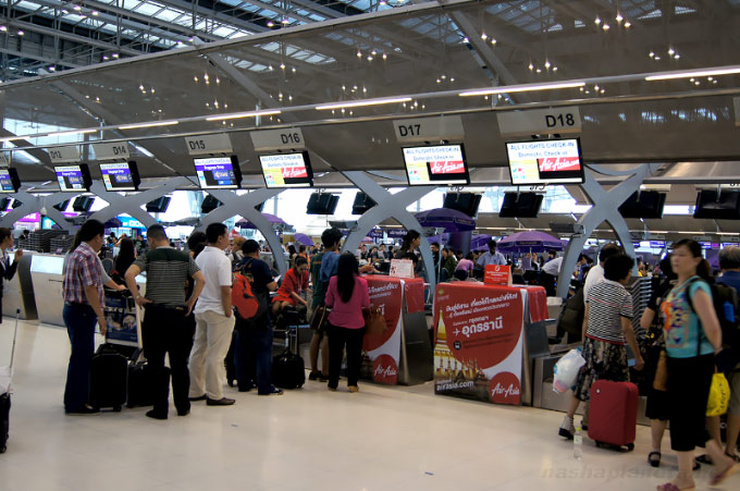Passenger with a ticket at the check-in counter at a Thailand airport